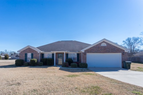 All brick ranch features 4 bedrooms, home office and almost 1/2 acre lot!